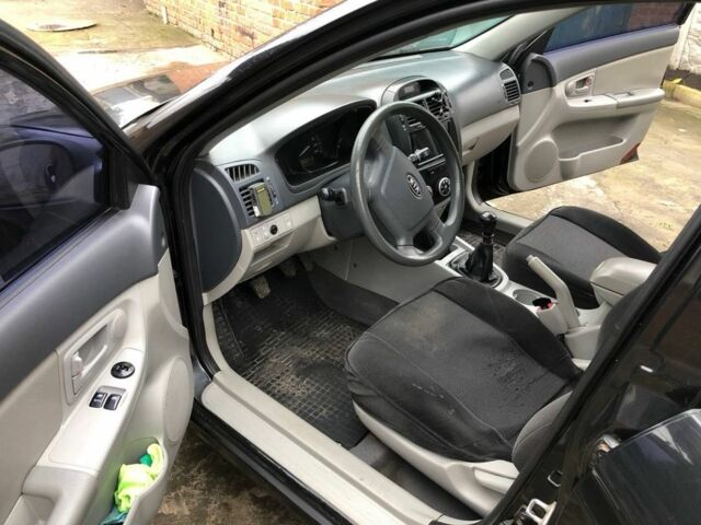 Черный Киа Черато, объемом двигателя 1.6 л и пробегом 240 тыс. км за 3300 $, фото 8 на Automoto.ua