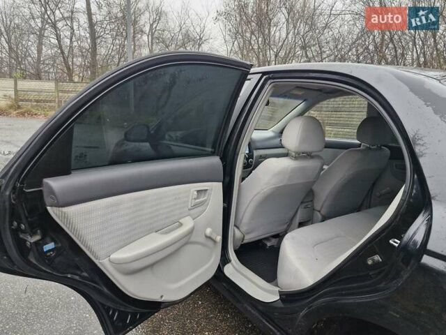 Черный Киа Черато, объемом двигателя 1.6 л и пробегом 280 тыс. км за 4300 $, фото 9 на Automoto.ua