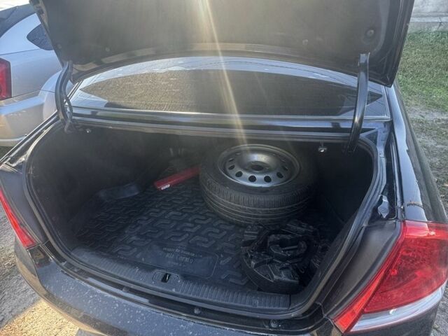 Черный Киа Черато, объемом двигателя 1.6 л и пробегом 126 тыс. км за 5200 $, фото 7 на Automoto.ua