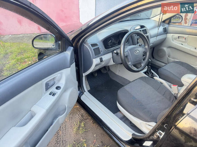 Чорний Кіа Черато, об'ємом двигуна 1.59 л та пробігом 250 тис. км за 4300 $, фото 12 на Automoto.ua