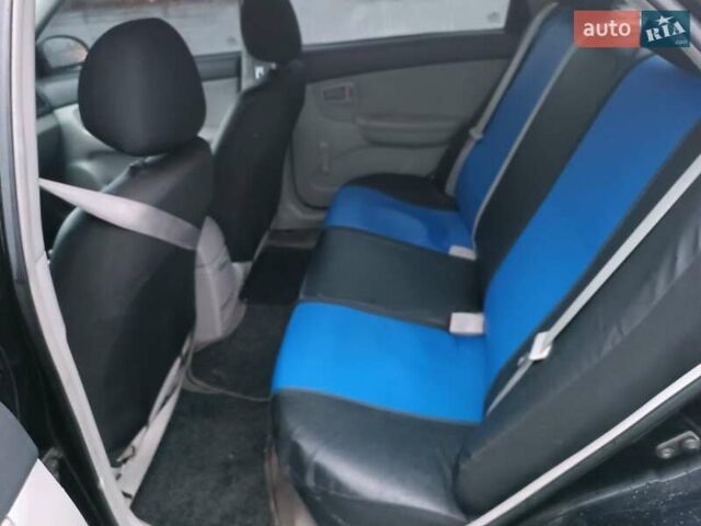 Черный Киа Черато, объемом двигателя 1.6 л и пробегом 260 тыс. км за 5200 $, фото 3 на Automoto.ua