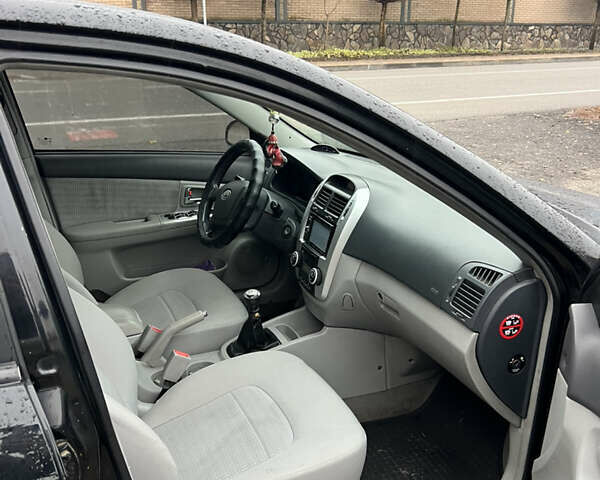 Черный Киа Черато, объемом двигателя 1.59 л и пробегом 273 тыс. км за 2999 $, фото 7 на Automoto.ua