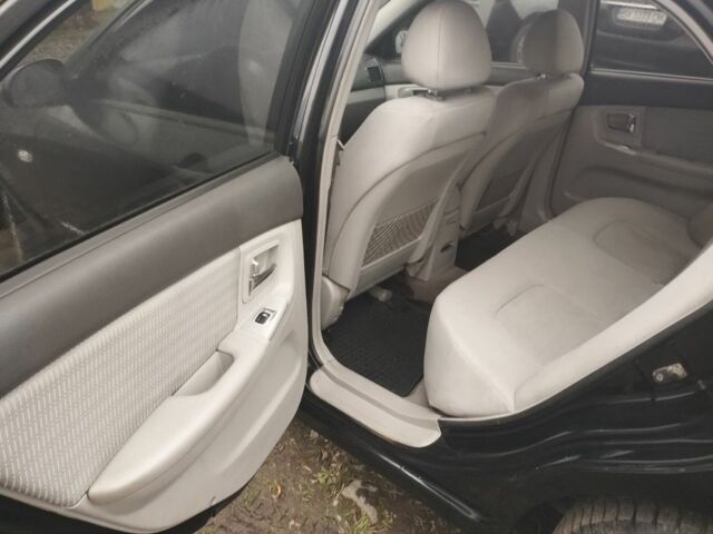 Черный Киа Черато, объемом двигателя 2 л и пробегом 380 тыс. км за 3600 $, фото 4 на Automoto.ua