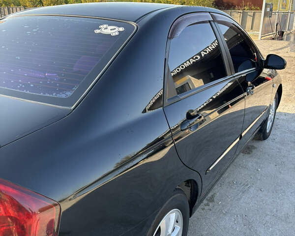 Черный Киа Черато, объемом двигателя 1.59 л и пробегом 314 тыс. км за 5000 $, фото 2 на Automoto.ua