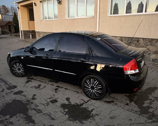 Чорний Кіа Черато, об'ємом двигуна 1.6 л та пробігом 197 тис. км за 5500 $, фото 2 на Automoto.ua