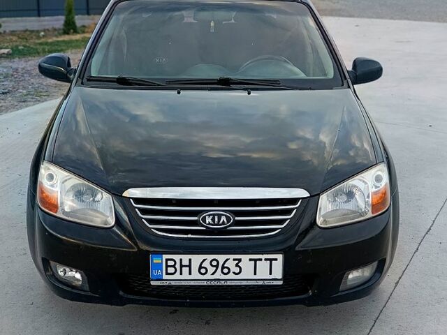 Черный Киа Черато, объемом двигателя 1.6 л и пробегом 210 тыс. км за 4000 $, фото 1 на Automoto.ua