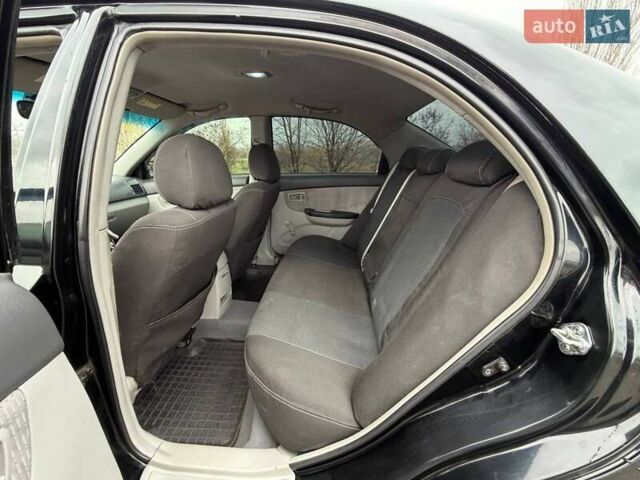 Чорний Кіа Черато, об'ємом двигуна 1.6 л та пробігом 224 тис. км за 4900 $, фото 32 на Automoto.ua