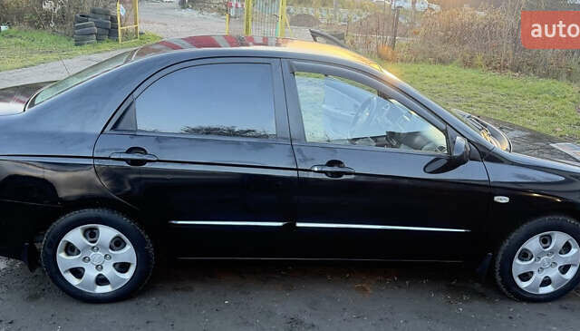 Чорний Кіа Черато, об'ємом двигуна 1.59 л та пробігом 250 тис. км за 4300 $, фото 1 на Automoto.ua