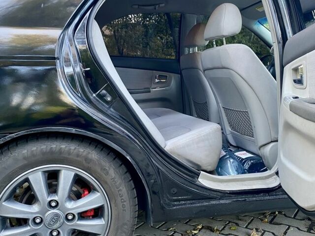 Черный Киа Черато, объемом двигателя 2 л и пробегом 302 тыс. км за 4600 $, фото 4 на Automoto.ua