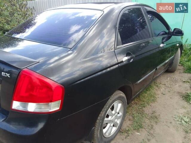 Чорний Кіа Черато, об'ємом двигуна 2 л та пробігом 310 тис. км за 4000 $, фото 1 на Automoto.ua