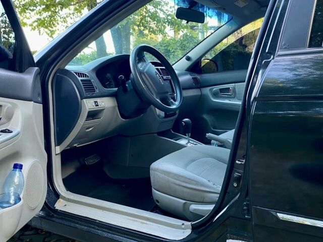 Черный Киа Черато, объемом двигателя 2 л и пробегом 302 тыс. км за 4600 $, фото 7 на Automoto.ua