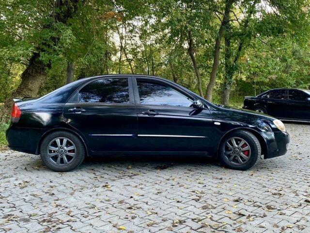 Черный Киа Черато, объемом двигателя 2 л и пробегом 302 тыс. км за 4600 $, фото 1 на Automoto.ua