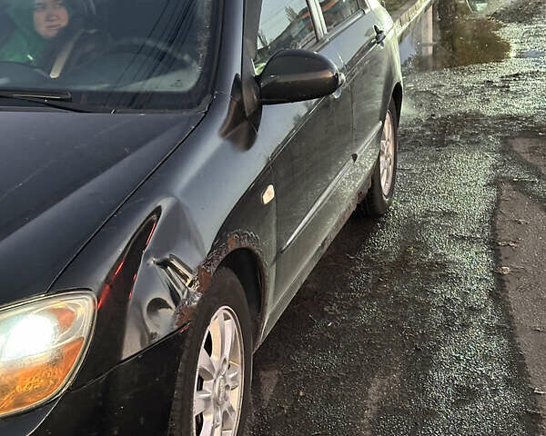 Черный Киа Черато, объемом двигателя 1.6 л и пробегом 294 тыс. км за 3500 $, фото 6 на Automoto.ua