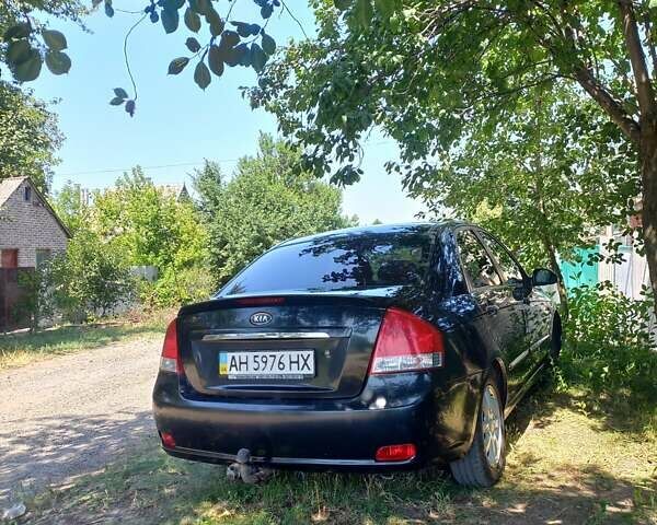 Черный Киа Черато, объемом двигателя 1.98 л и пробегом 300 тыс. км за 4600 $, фото 3 на Automoto.ua