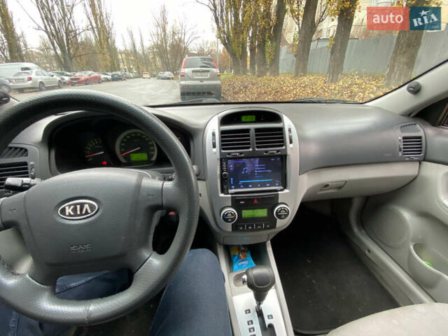 Черный Киа Черато, объемом двигателя 1.98 л и пробегом 306 тыс. км за 3800 $, фото 4 на Automoto.ua
