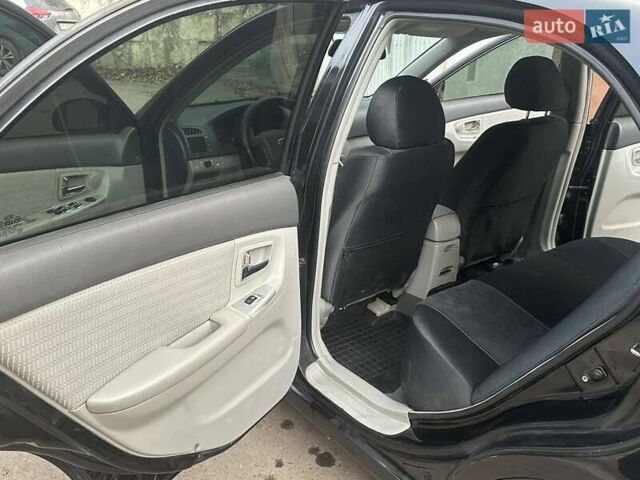 Черный Киа Черато, объемом двигателя 1.6 л и пробегом 230 тыс. км за 4950 $, фото 6 на Automoto.ua