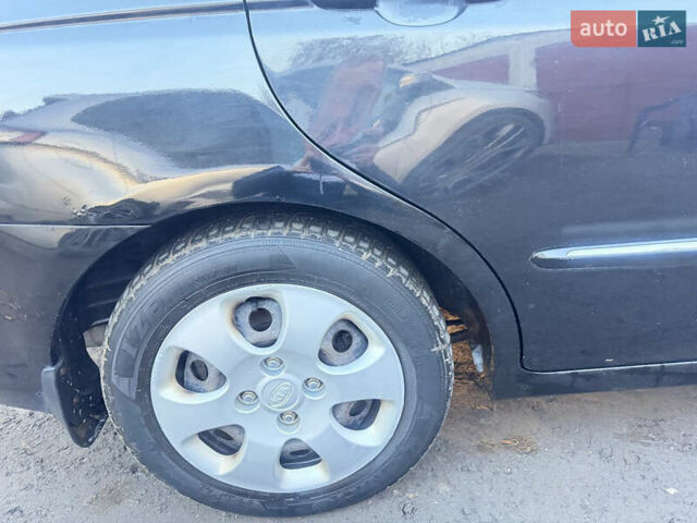 Чорний Кіа Черато, об'ємом двигуна 1.59 л та пробігом 250 тис. км за 4300 $, фото 8 на Automoto.ua