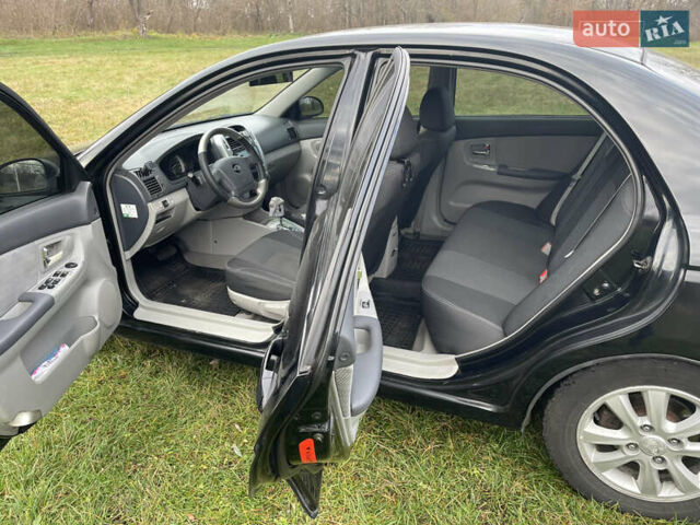 Черный Киа Черато, объемом двигателя 1.98 л и пробегом 315 тыс. км за 5745 $, фото 9 на Automoto.ua