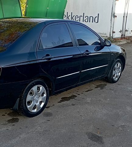 Черный Киа Черато, объемом двигателя 1.6 л и пробегом 221 тыс. км за 4500 $, фото 3 на Automoto.ua