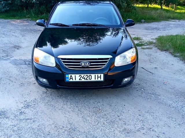 Чорний Кіа Черато, об'ємом двигуна 2 л та пробігом 203 тис. км за 5500 $, фото 1 на Automoto.ua