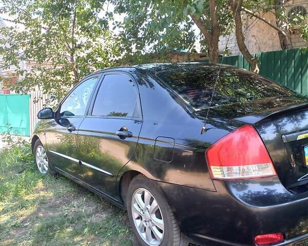 Черный Киа Черато, объемом двигателя 1.98 л и пробегом 300 тыс. км за 4600 $, фото 1 на Automoto.ua