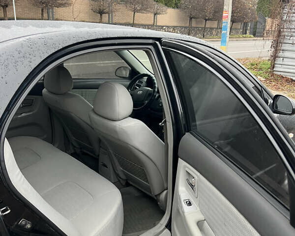 Черный Киа Черато, объемом двигателя 1.59 л и пробегом 273 тыс. км за 2999 $, фото 8 на Automoto.ua