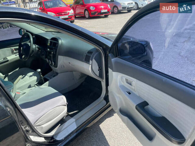 Черный Киа Черато, объемом двигателя 1.59 л и пробегом 210 тыс. км за 4100 $, фото 7 на Automoto.ua