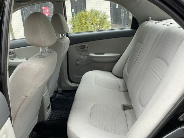 Черный Киа Черато, объемом двигателя 1.6 л и пробегом 256 тыс. км за 4200 $, фото 7 на Automoto.ua