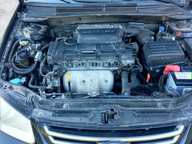 Чорний Кіа Черато, об'ємом двигуна 2 л та пробігом 203 тис. км за 5500 $, фото 4 на Automoto.ua