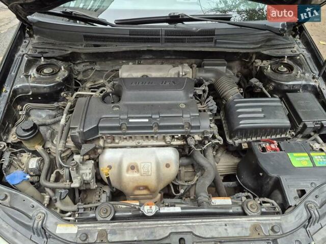 Черный Киа Черато, объемом двигателя 1.98 л и пробегом 180 тыс. км за 4500 $, фото 8 на Automoto.ua