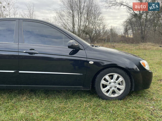 Черный Киа Черато, объемом двигателя 1.98 л и пробегом 315 тыс. км за 5745 $, фото 5 на Automoto.ua