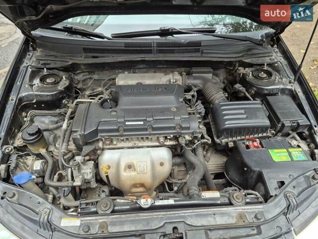 Черный Киа Черато, объемом двигателя 1.98 л и пробегом 180 тыс. км за 4500 $, фото 9 на Automoto.ua