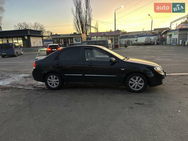 Черный Киа Черато, объемом двигателя 1.6 л и пробегом 294 тыс. км за 3500 $, фото 1 на Automoto.ua