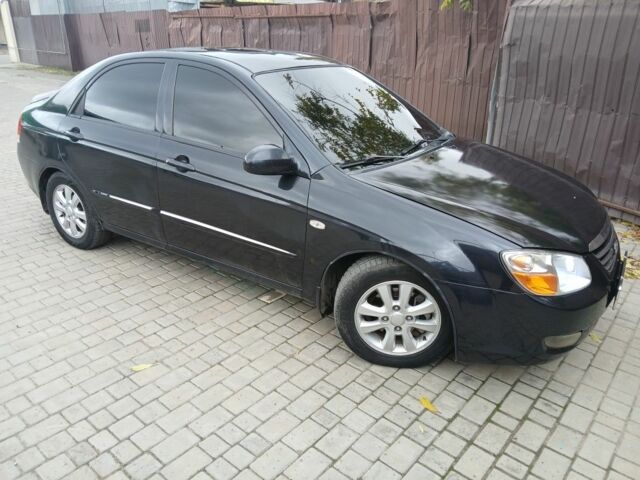 Черный Киа Черато, объемом двигателя 2 л и пробегом 250 тыс. км за 3700 $, фото 1 на Automoto.ua