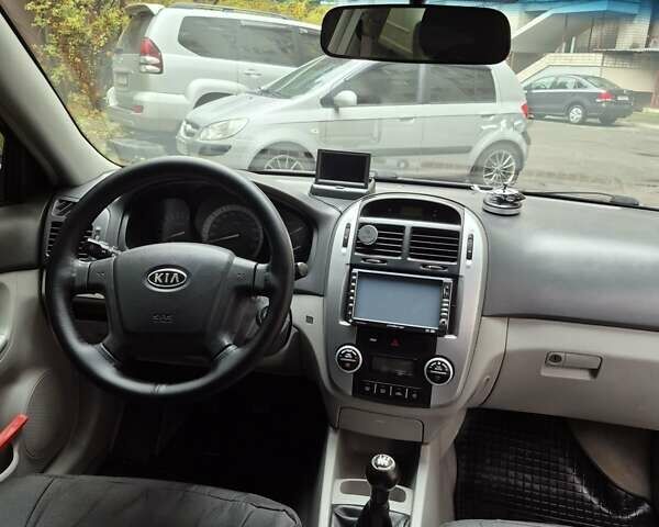 Черный Киа Черато, объемом двигателя 1.98 л и пробегом 180 тыс. км за 4500 $, фото 13 на Automoto.ua