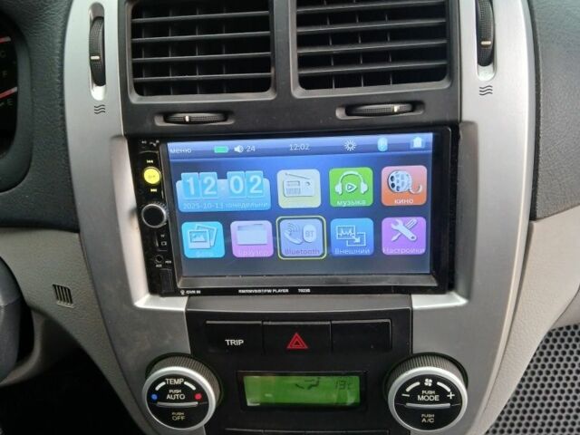 Черный Киа Черато, объемом двигателя 2 л и пробегом 250 тыс. км за 3700 $, фото 12 на Automoto.ua