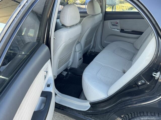 Чорний Кіа Черато, об'ємом двигуна 2 л та пробігом 362 тис. км за 3900 $, фото 6 на Automoto.ua