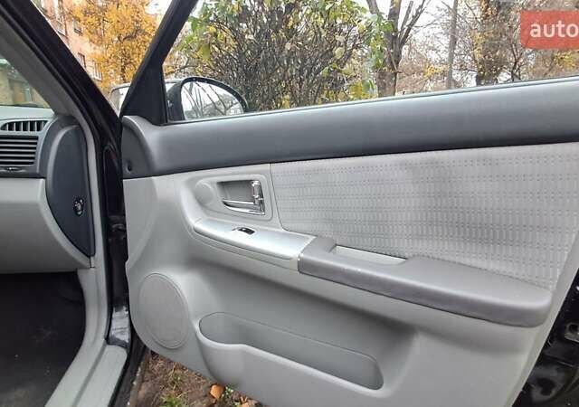 Черный Киа Черато, объемом двигателя 1.59 л и пробегом 349 тыс. км за 4000 $, фото 1 на Automoto.ua