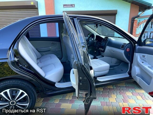 Черный Киа Черато, объемом двигателя 1.6 л и пробегом 190 тыс. км за 4350 $, фото 8 на Automoto.ua