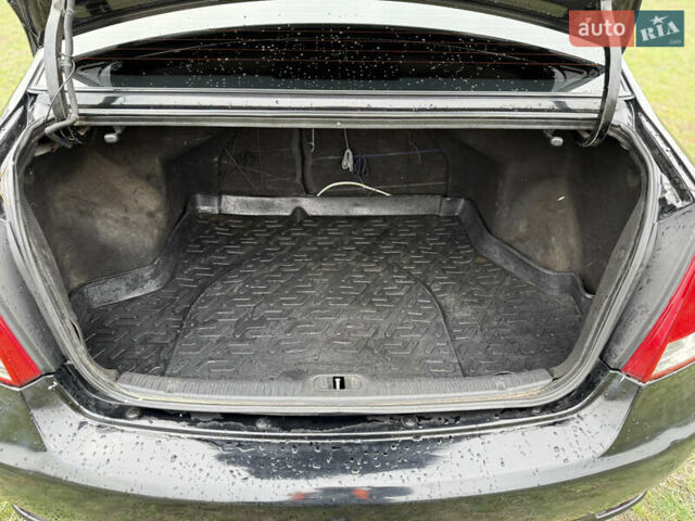 Черный Киа Черато, объемом двигателя 1.59 л и пробегом 312 тыс. км за 3000 $, фото 11 на Automoto.ua