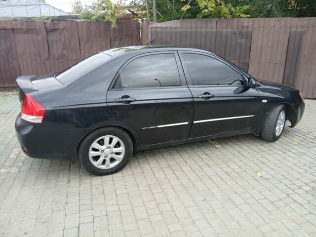 Черный Киа Черато, объемом двигателя 2 л и пробегом 250 тыс. км за 3700 $, фото 4 на Automoto.ua