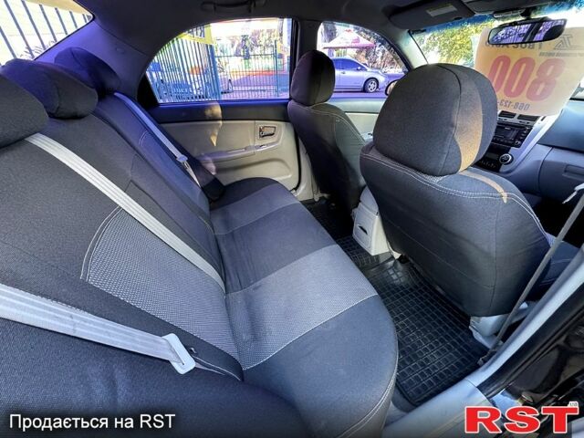 Черный Киа Черато, объемом двигателя 1.6 л и пробегом 174 тыс. км за 4550 $, фото 5 на Automoto.ua