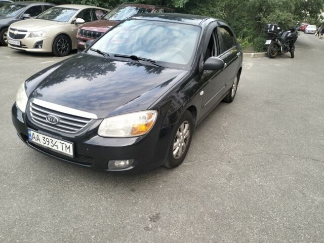 Чорний Кіа Черато, об'ємом двигуна 2 л та пробігом 246 тис. км за 4200 $, фото 1 на Automoto.ua
