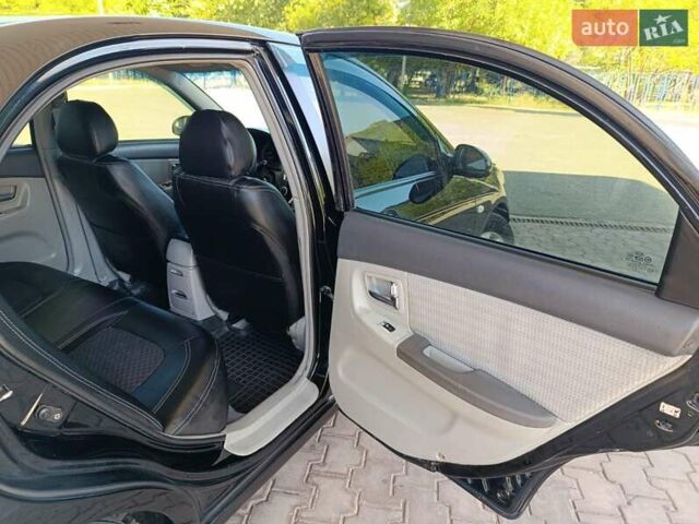 Чорний Кіа Черато, об'ємом двигуна 1.59 л та пробігом 219 тис. км за 4600 $, фото 47 на Automoto.ua