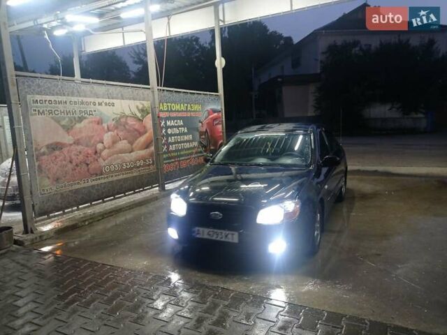 Черный Киа Черато, объемом двигателя 2 л и пробегом 340 тыс. км за 5500 $, фото 1 на Automoto.ua