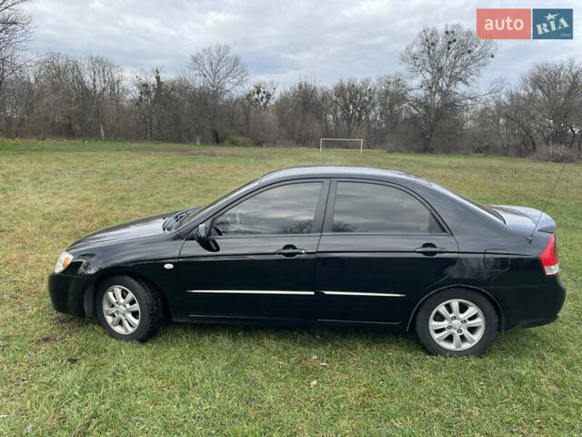 Черный Киа Черато, объемом двигателя 1.98 л и пробегом 315 тыс. км за 5745 $, фото 3 на Automoto.ua