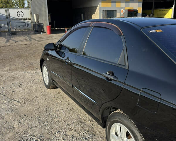 Черный Киа Черато, объемом двигателя 1.59 л и пробегом 314 тыс. км за 5000 $, фото 4 на Automoto.ua