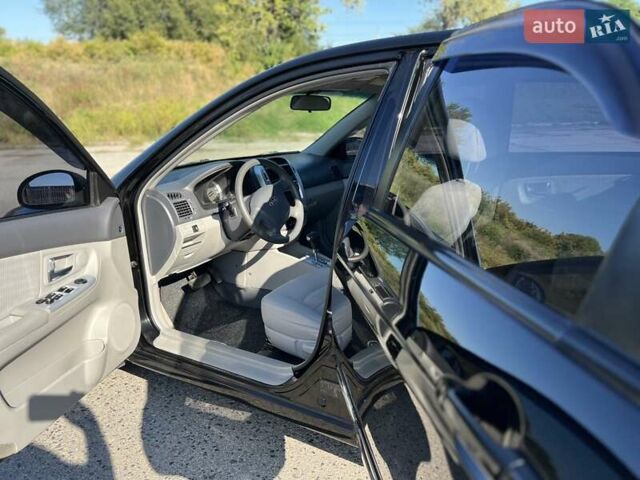 Чорний Кіа Черато, об'ємом двигуна 1.98 л та пробігом 163 тис. км за 5500 $, фото 4 на Automoto.ua