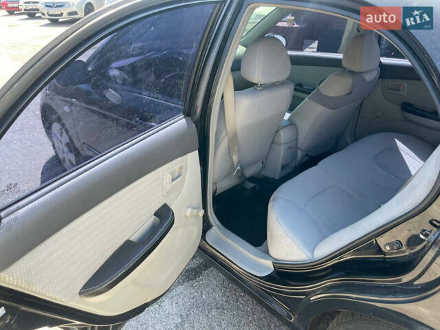 Черный Киа Черато, объемом двигателя 1.59 л и пробегом 210 тыс. км за 4100 $, фото 11 на Automoto.ua