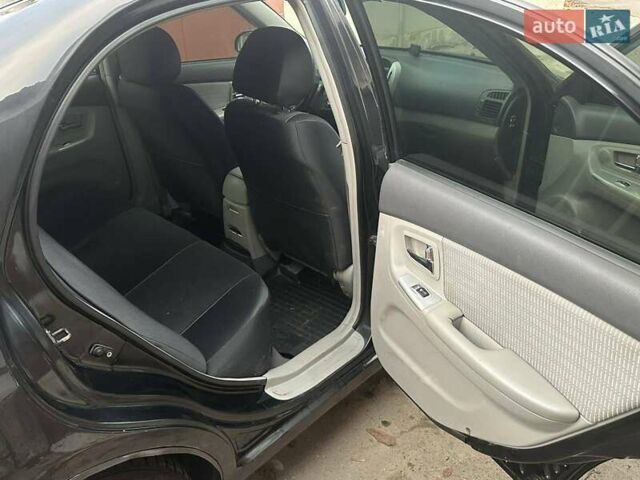 Черный Киа Черато, объемом двигателя 1.6 л и пробегом 230 тыс. км за 4950 $, фото 8 на Automoto.ua